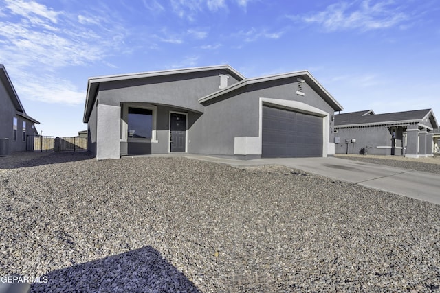 view of front of house featuring cooling unit and a garage