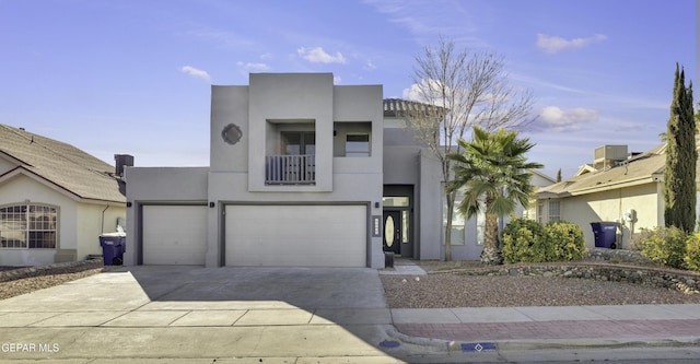 view of front of home featuring a balcony and a garage