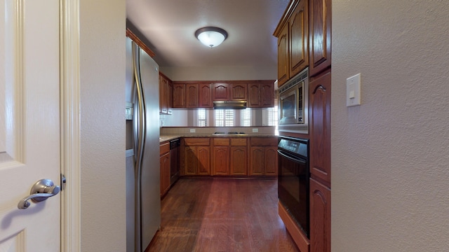 kitchen with black appliances and dark hardwood / wood-style flooring