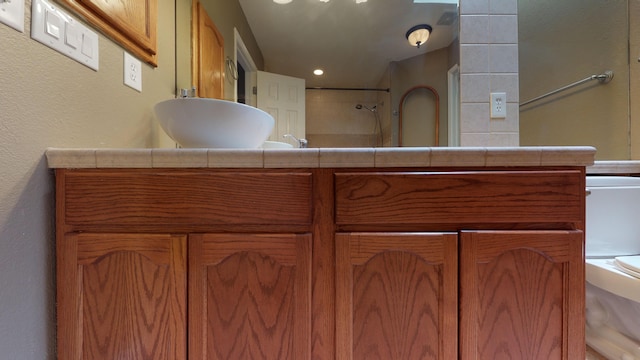 bathroom featuring vanity and walk in shower