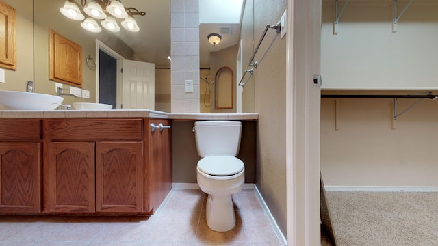 bathroom with vanity, toilet, and walk in shower