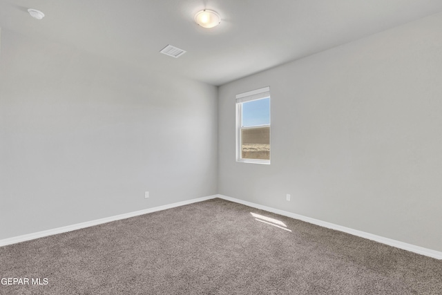 empty room featuring carpet floors