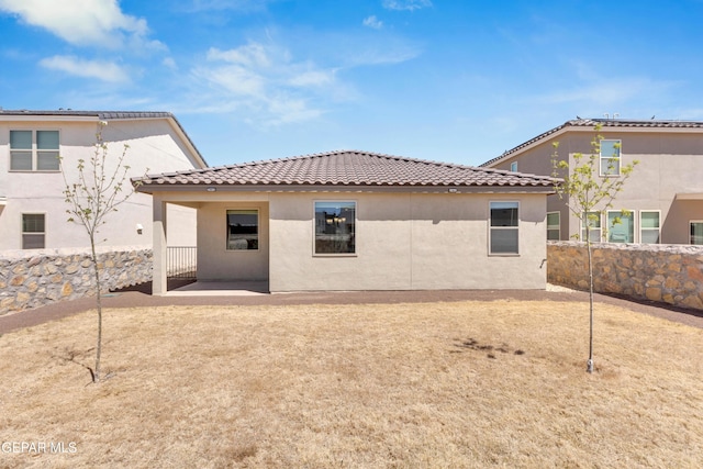 back of property featuring a patio area