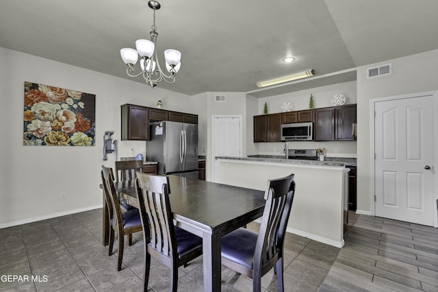 dining space featuring an inviting chandelier