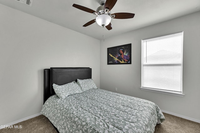 bedroom with ceiling fan and carpet floors