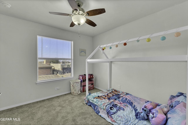 carpeted bedroom featuring ceiling fan