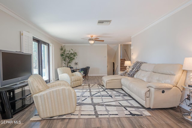 living room with ceiling fan, hardwood / wood-style floors, and ornamental molding