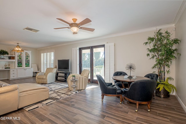 living room featuring ceiling fan, wood-type flooring, and ornamental molding