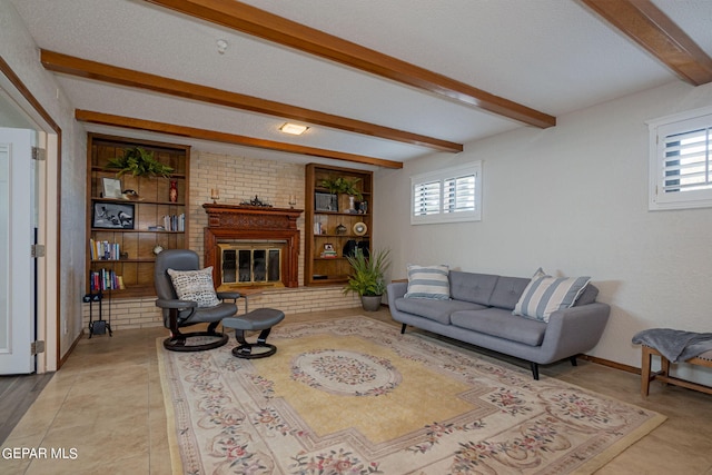 tiled living room featuring beam ceiling, a wealth of natural light, a fireplace, and built in features