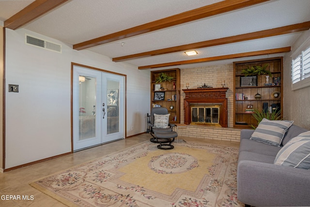 living room featuring french doors, beamed ceiling, a textured ceiling, a fireplace, and light tile patterned floors