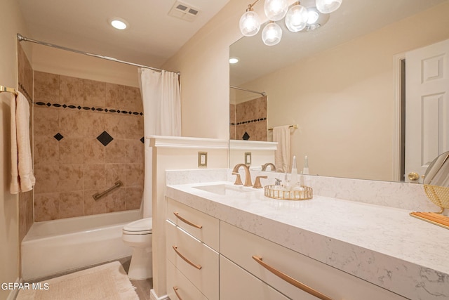 full bathroom featuring shower / bath combo, toilet, and vanity