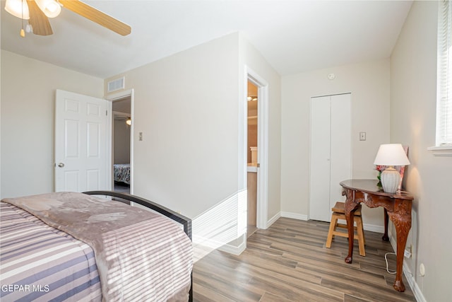 bedroom featuring ceiling fan, a closet, and hardwood / wood-style floors