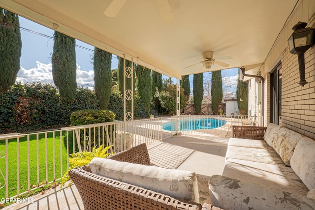 exterior space featuring ceiling fan and a yard