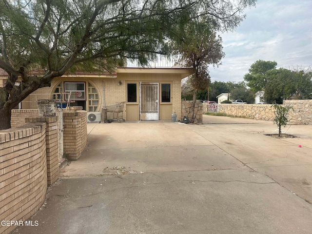 view of front of property featuring ac unit