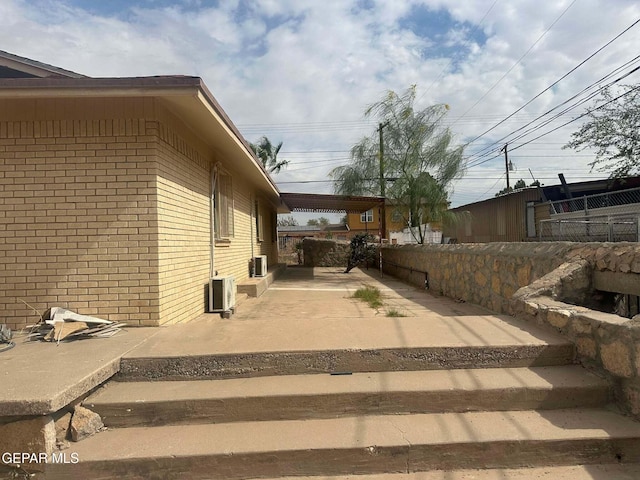 view of side of property with a patio