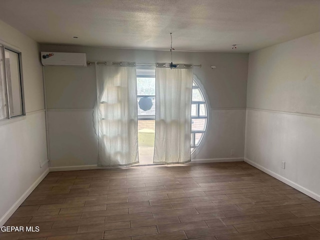 unfurnished dining area with an AC wall unit