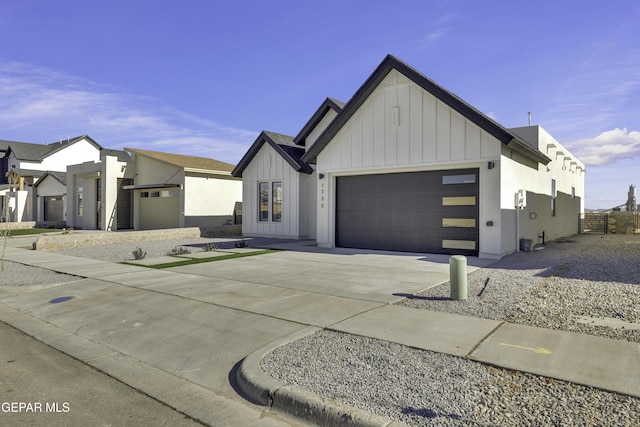1762 Green Valley St, El Paso, TX 79928 - modern inspired farmhouse with board and batten siding, an attached garage, and concrete driveway