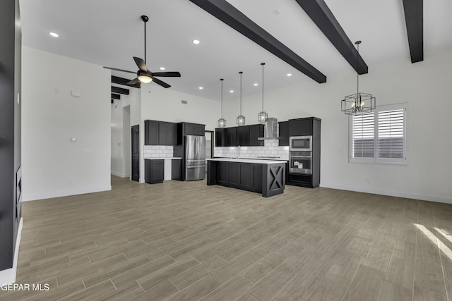 1762 Green Valley St, El Paso, TX 79928 - kitchen featuring open floor plan, appliances with stainless steel finishes, beam ceiling, recessed lighting, and a high ceiling