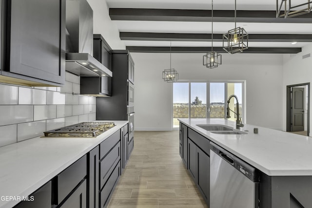 1762 Green Valley St, El Paso, TX 79928 - kitchen featuring stainless steel appliances, a sink, wall chimney exhaust hood, beamed ceiling, and tasteful backsplash