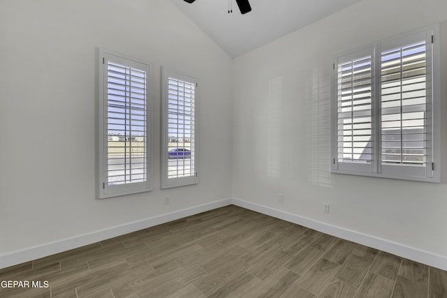 1762 Green Valley St, El Paso, TX 79928 - empty room with a ceiling fan, plenty of natural light, lofted ceiling, wood finished floors, and baseboards
