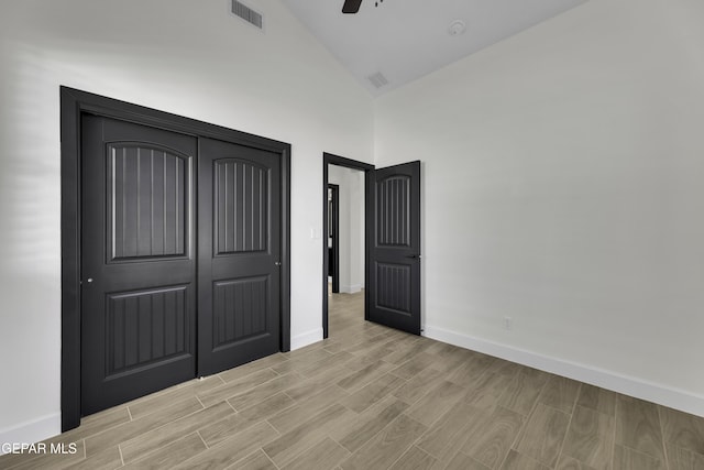 1762 Green Valley St, El Paso, TX 79928 - unfurnished bedroom with high vaulted ceiling, baseboards, light wood-style floors, ceiling fan, and a closet