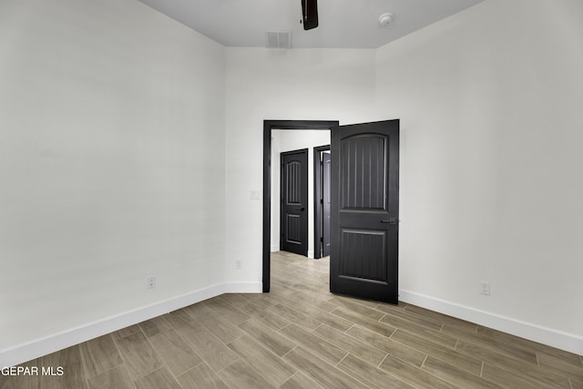 1762 Green Valley St, El Paso, TX 79928 - spare room featuring baseboards, wood finished floors, ceiling fan, and a smoke detector