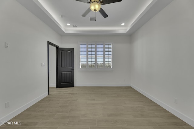1762 Green Valley St, El Paso, TX 79928 - unfurnished room with a raised ceiling, ceiling fan, baseboards, recessed lighting, and a smoke detector
