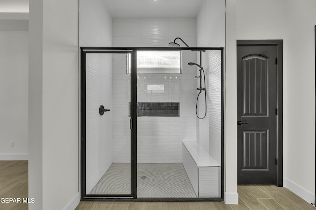 1762 Green Valley St, El Paso, TX 79928 - bathroom with a stall shower, wood finished floors, and baseboards