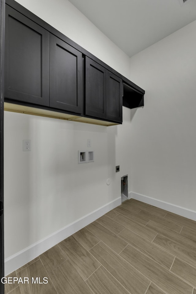 1762 Green Valley St, El Paso, TX 79928 - laundry area featuring hookup for an electric dryer, cabinet space, washer hookup, baseboards, and gas dryer hookup