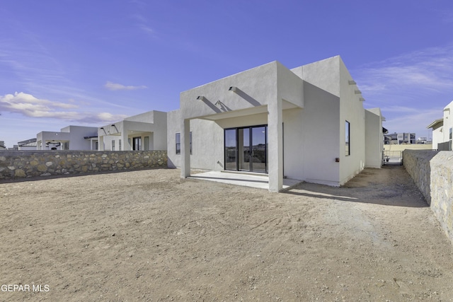 1762 Green Valley St, El Paso, TX 79928 - rear view of property with a fenced backyard, stucco siding, a residential view, and a patio area