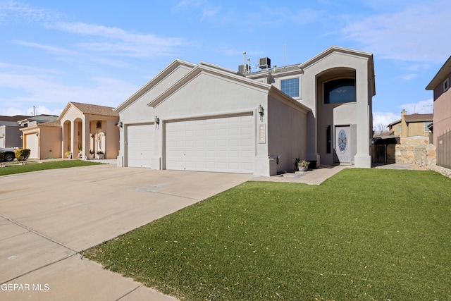 view of front facade with a garage and a front lawn