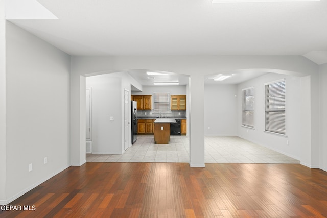 unfurnished living room with light wood-type flooring