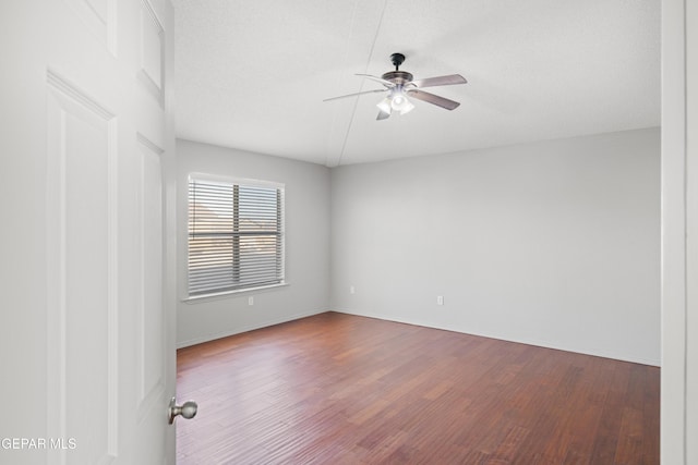 unfurnished room featuring ceiling fan and wood-type flooring