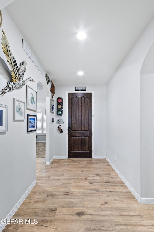 foyer with light hardwood / wood-style flooring