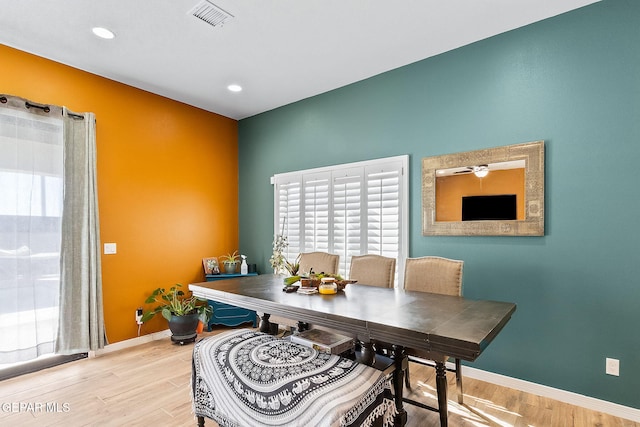 dining room featuring light hardwood / wood-style flooring and ceiling fan