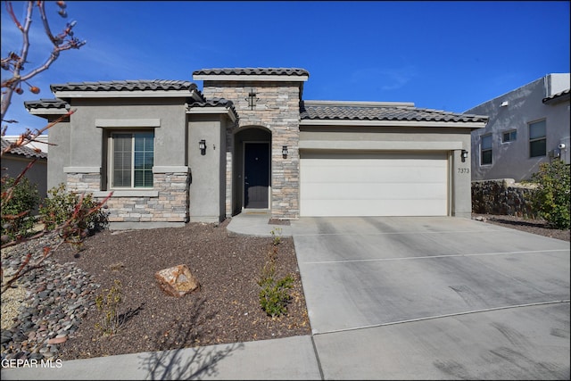 view of front of property with a garage