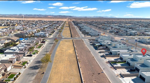 birds eye view of property featuring a mountain view