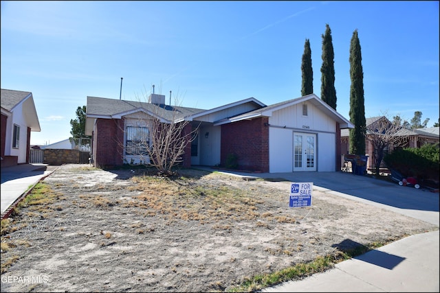 12560 Angie Bombach Ave, El Paso, TX 79928 - ranch-style home with central AC and french doors