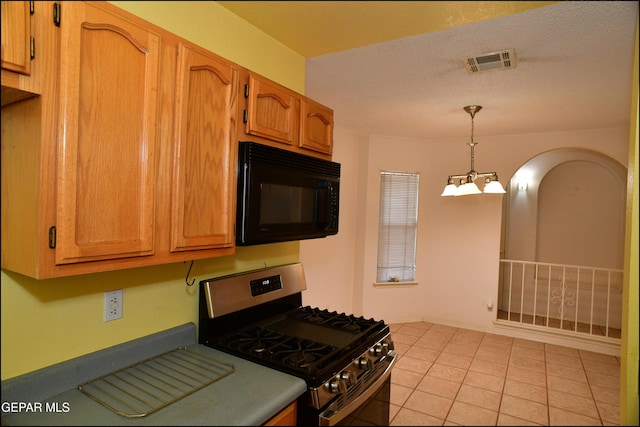 12560 Angie Bombach Ave, El Paso, TX 79928 - kitchen featuring an inviting chandelier, stainless steel gas range, a textured ceiling, decorative light fixtures, and light tile patterned flooring