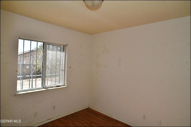 12560 Angie Bombach Ave, El Paso, TX 79928 - empty room with dark hardwood / wood-style flooring