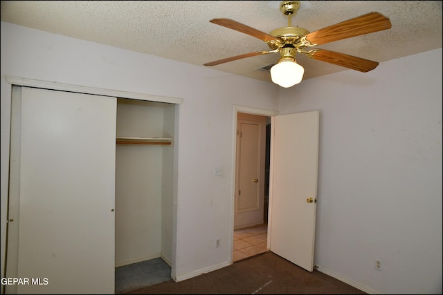 12560 Angie Bombach Ave, El Paso, TX 79928 - unfurnished bedroom with ceiling fan, a closet, and a textured ceiling
