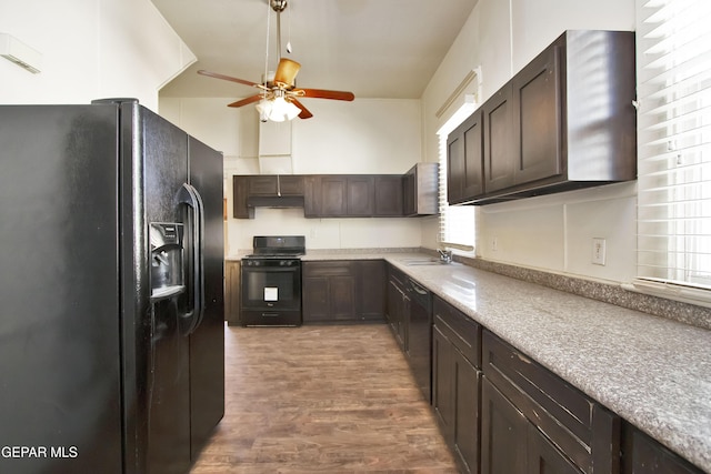 kitchen featuring dark brown cabinetry, sink, ceiling fan, and black appliances