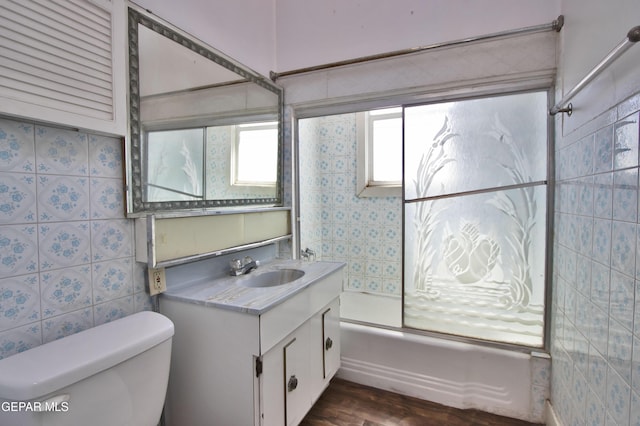 full bathroom with vanity, shower / bathtub combination, toilet, and wood-type flooring