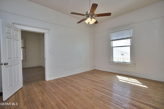 unfurnished room featuring ceiling fan and hardwood / wood-style flooring