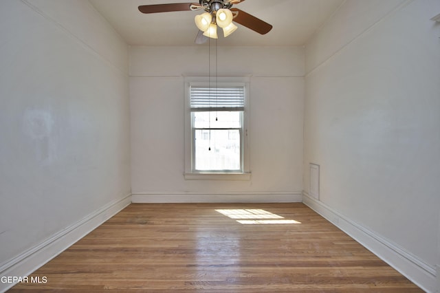 unfurnished room featuring light hardwood / wood-style flooring and ceiling fan