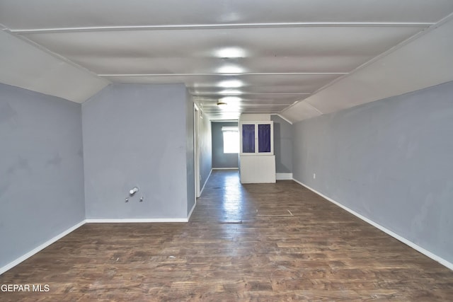 bonus room featuring dark hardwood / wood-style floors and lofted ceiling