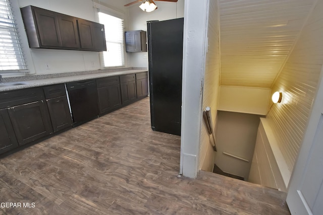 kitchen featuring sink, dark brown cabinetry, ceiling fan, and black appliances