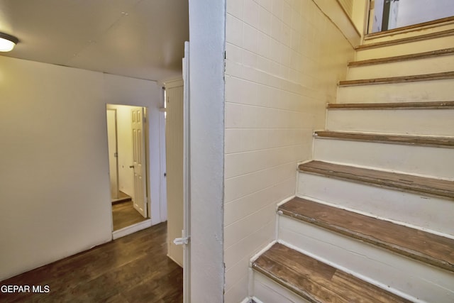 stairs with hardwood / wood-style flooring