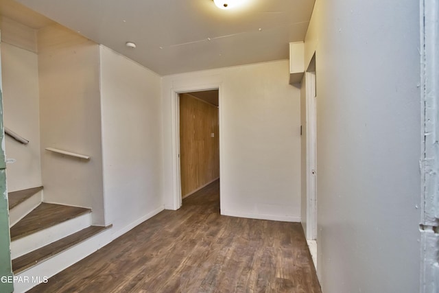 unfurnished room with dark wood-type flooring