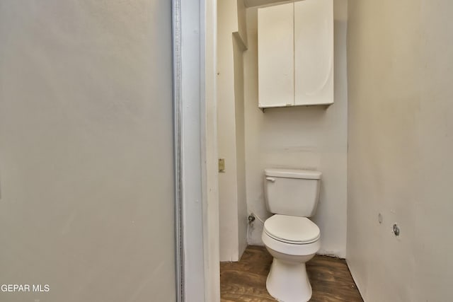 bathroom with wood-type flooring and toilet